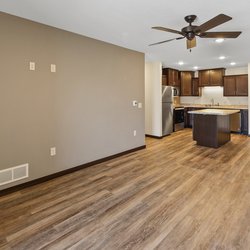 wood floor living room at Rivertown Residential Suites located in Monticello, MN
